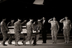 Last Respects: President Obama attends the dignified transfer of U.S. Army Sgt. Dale R. Griffin shortly before four in the morning at Dover Air Force Base, Delaware. Griffin is one of 18 U.S. personnel who died Monday in Afghanistan and returned to the U.S. on board an Air Force C-17 military transport plane.