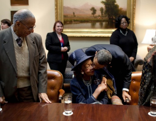 President Barack Obama kisses Dr. Dorothy Height during a meeting on Martin Luther King Jr. Day in the Roosevelt Room of the White House.