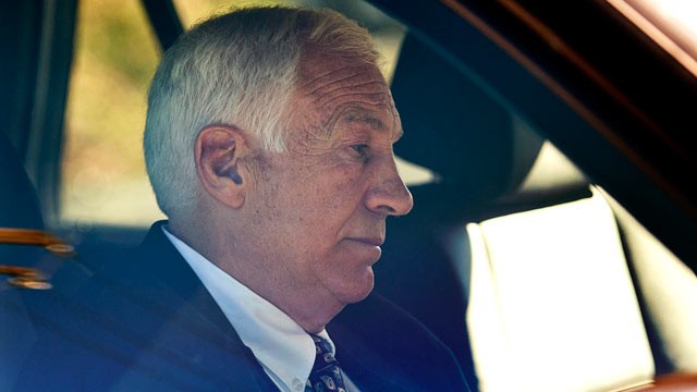 Gerald "Jerry" Sandusky sits in a car as he leaves the office of Center County Magisterial District Judge Leslie A. Dutchcot, Nov. 5, 2011, in State College, Pa. (Andy Colwell/The Patriot-News/AP)