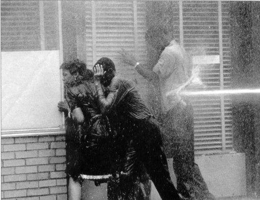 Water cannon attack on black Civil Rights demonstrators in 1963 in Birmingham, Alabama. The water was propelled at 100 lbs/sq inch. (Charlie Moore)